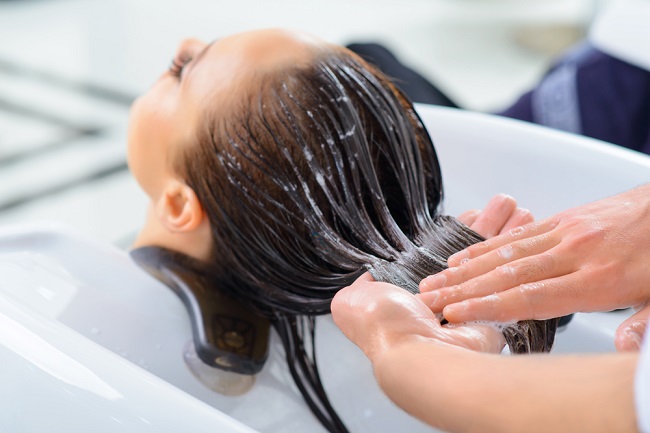 Professional,Treatment.,Client,Is,Resting,While,Her,Hair,Is,Being